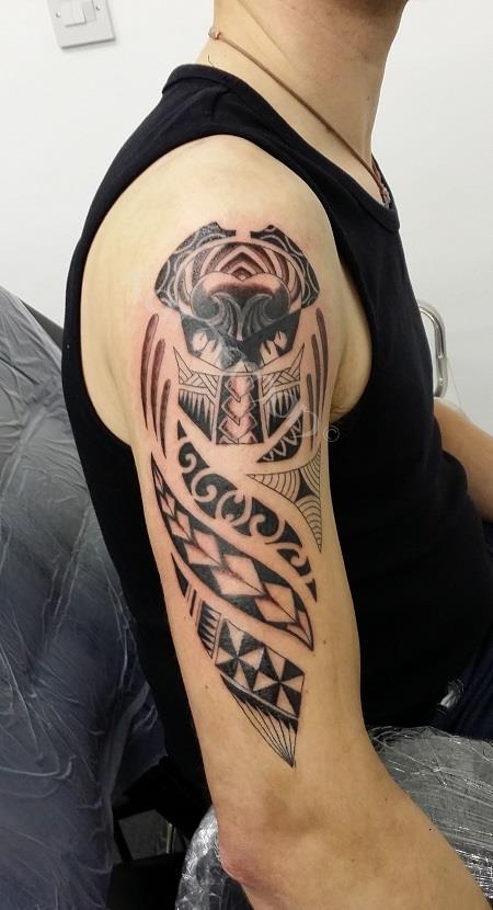 Predator maori arm tattoo